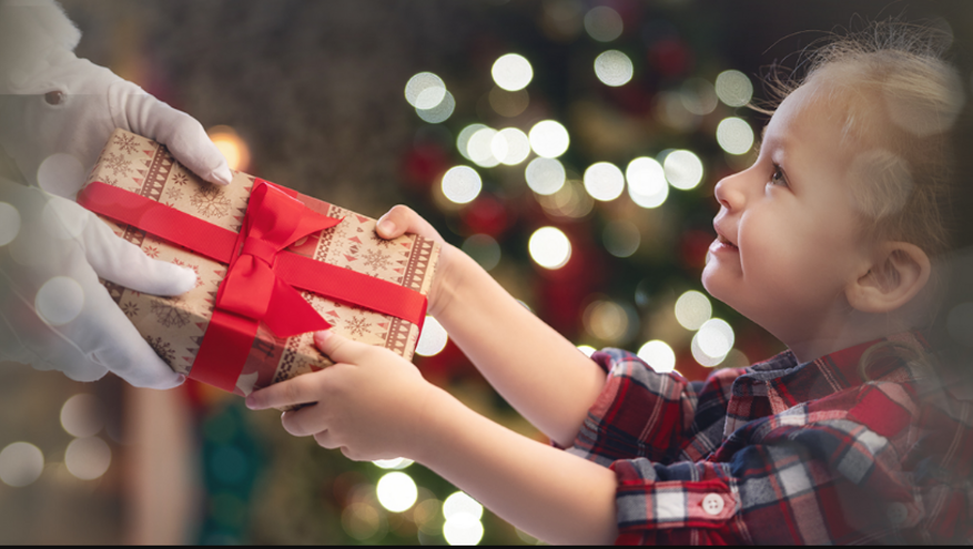 Child accepts a gift from Santa