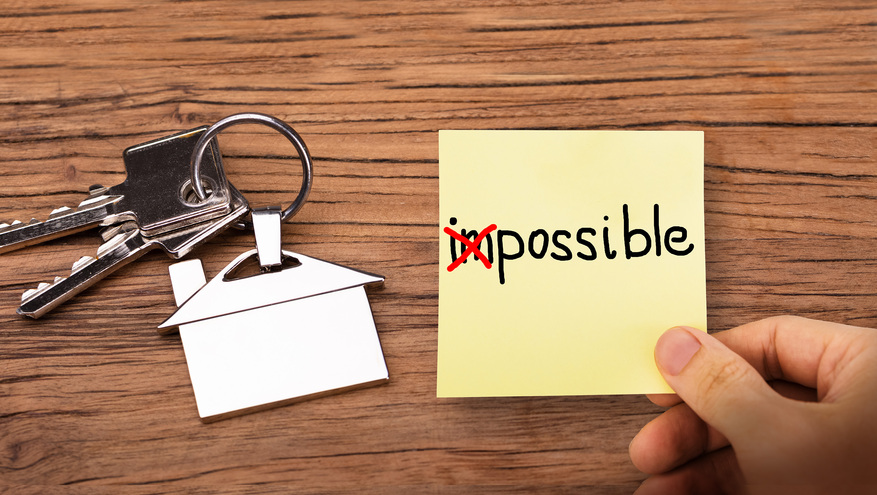 The word "impossible" is written on a post-it note, with the letters "i" and "m" crossed out to spell "possible