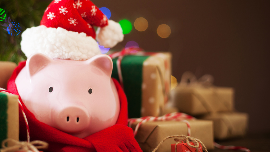 A piggy bank wearing a Santa hat