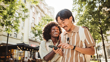 young family running into new home
