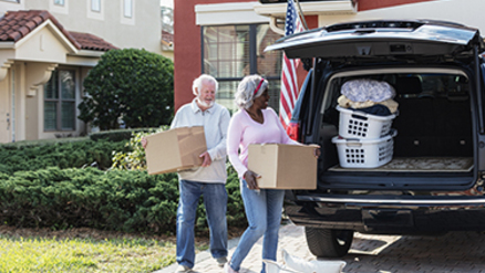 senior couple cooking dinner together