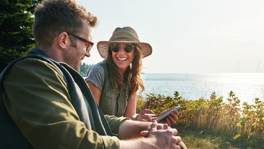 couple sitting together happily in nature