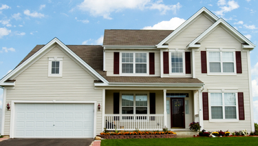 Two story house with attached garage.