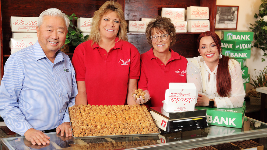 Idle Isle Candy company with Bank of Utah loan officer Norman Fukui and Branch Manager Melissa Bernson with owners Shari Van Dyke and Julie Gailey